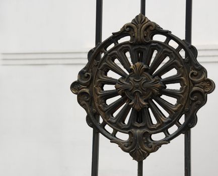 Iron ornament. The forged pattern from steel on a gate of church