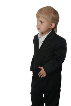 The boy in a suit. It is isolated on a white background. Age 3 years