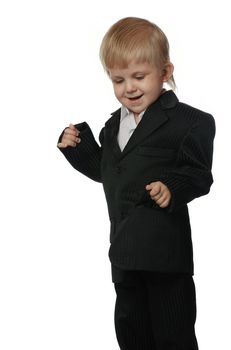 The boy in a suit. It is isolated on a white background. Age 3 years