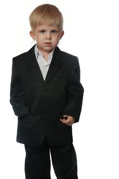 The boy in a suit. It is isolated on a white background. Age 3 years