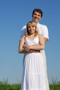 Pair enamoured. Happy family on a background of the blue sky