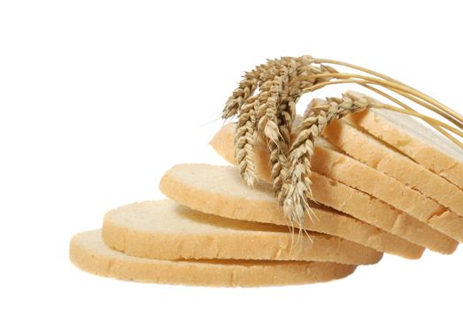 Wheat and cut bread. A ripe agriculture isolated on a white background