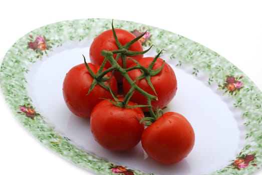 Tomato. It is isolated on a white background. A ripe vegetable.