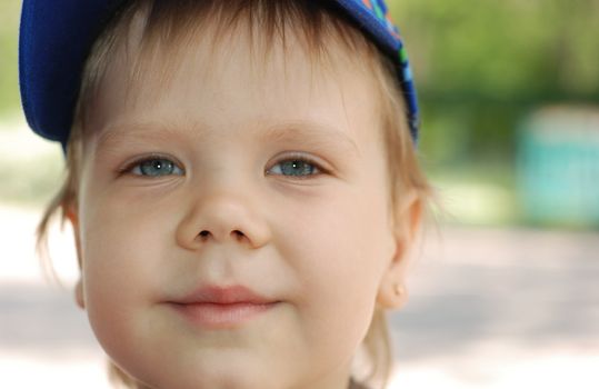 Portrait of the boy. The child with blue eyes, white hair