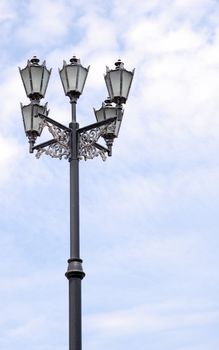 Ancient lantern. A lamppost, with a metal ornament