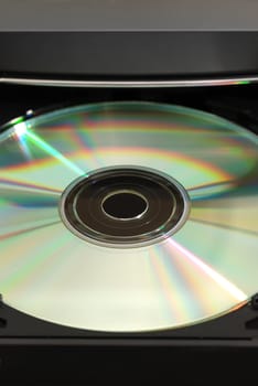 Disk in the  drive. A photo close up CD of a disk