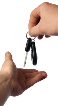 Transfer of keys from car. The isolated sheaf of keys from the car in a hand. The isolated sheaf of keys from the car in a hand