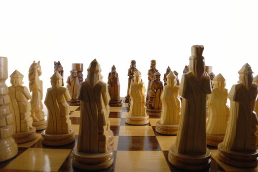 messenger pawn. The placed party from chessmen. Figures - from a tree, manual work