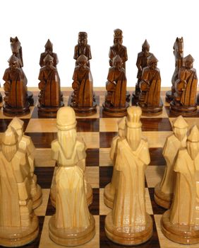 Chess. The placed party from chessmen. Figures - from a tree, manual work