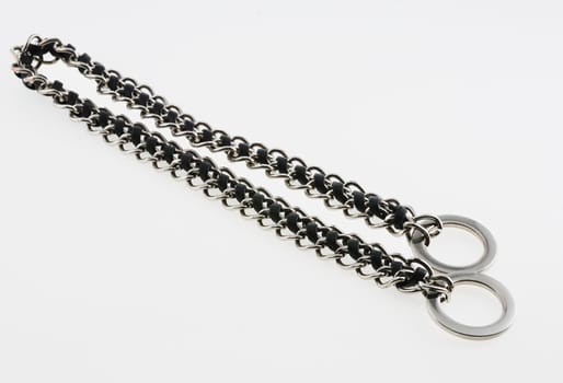 chain with ring and  the inserted leather thong. It is isolated on a white background