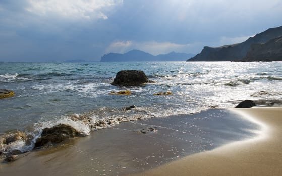 Sea coast with storm clouds and an effective luminescence of water