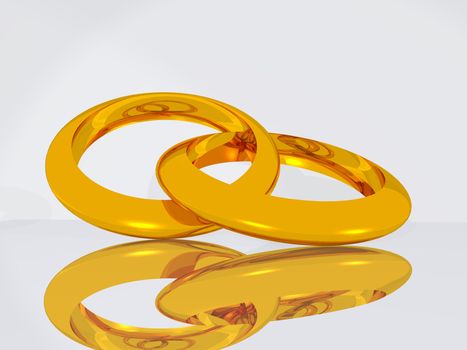 Wedding gold rings on a smooth surface