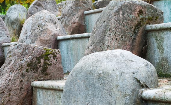 gray boulders with on the large stone stairs