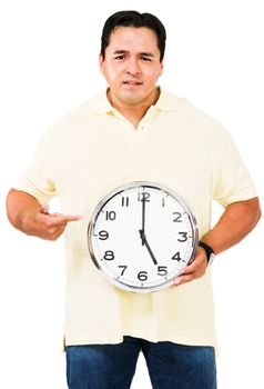Mid adult man pointing at a clock isolated over white
