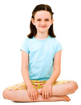 Caucasian girl sitting and smiling isolated over white