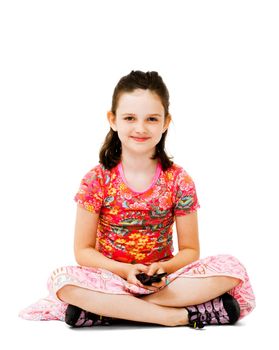 Happy girl text messaging on a mobile phone isolated over white