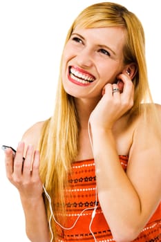 Cheerful woman listening to music on MP3 player isolated over white