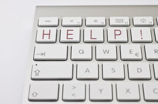 red "HELP!" on white keyboard