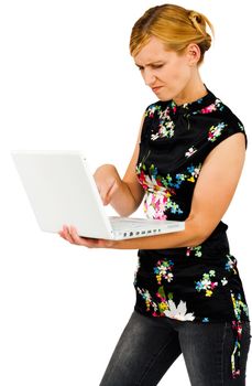 Frustrate young woman using a laptop isolated over white