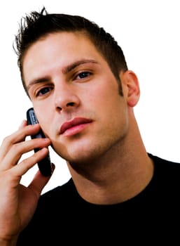 Young man talking on a mobile phone isolated over white