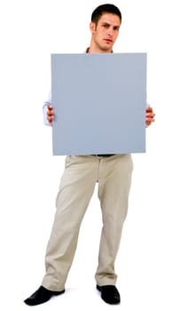 Young man showing an empty placard isolated over white