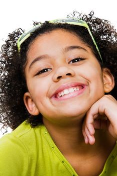 Portrait of a girl smiling isolated over white