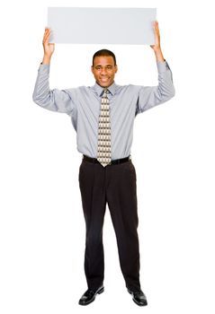 Happy businessman showing a blank placard isolated over white