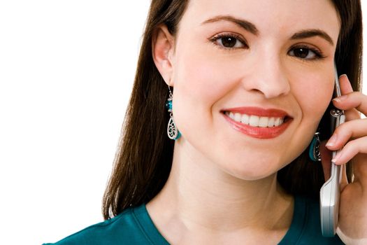 Portrait of a woman talking on a mobile phone isolated over white