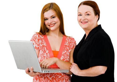 Happy women using a laptop isolated over white