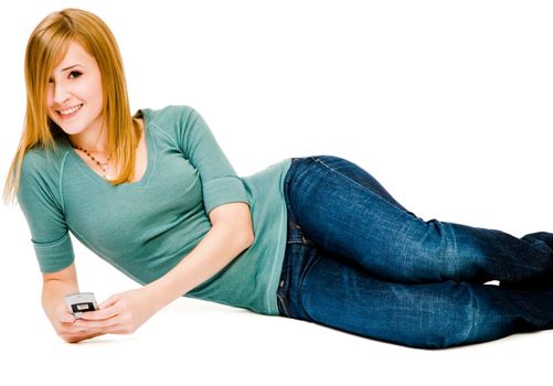 Smiling woman text messaging on a mobile phone isolated over white