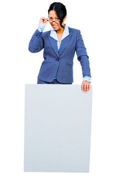 Happy businesswoman showing a placard and posing isolated over white