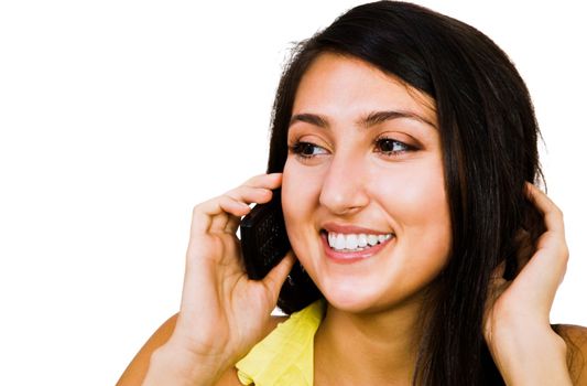 Confident woman talking on a mobile phone isolated over white