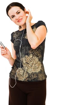 Fashion model listening to music on MP3 player isolated over white