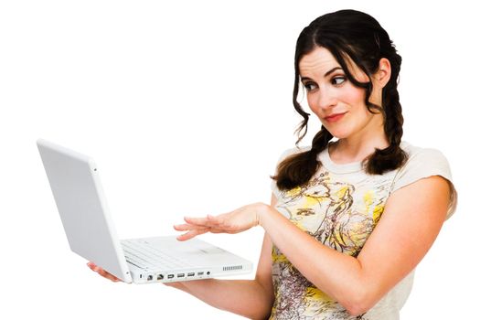 Happy young woman using a laptop isolated over white