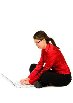 Mid adult woman using a laptop isolated over white