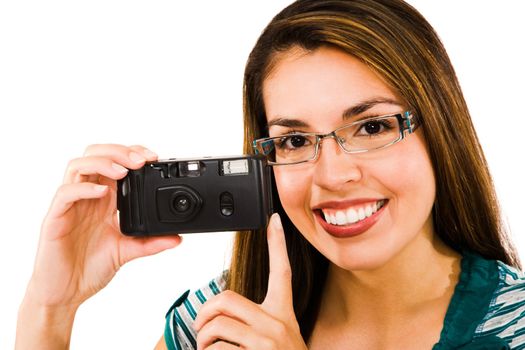 Fashion model photographing with a camera and smiling isolated over white