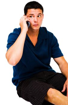 Fashion model talking on a mobile phone isolated over white