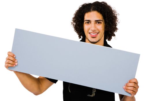 Smiling man showing an empty placard isolated over white