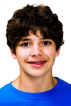 Confident boy posing and smiling isolated over white