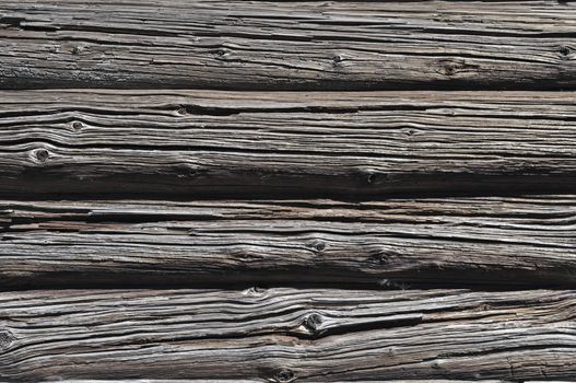 Fragment of log wall background of old wooden barn
