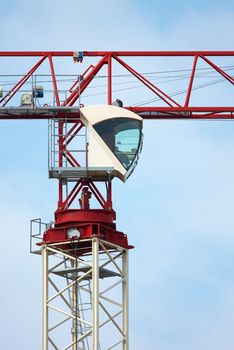 Detail of a tower crane against clear blue sky