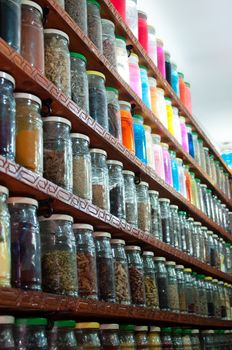 Jars of herbs and powders in a moroccan spice shop in the marrakech medina, Morocco