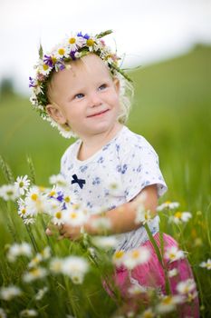 a small girl with flowers