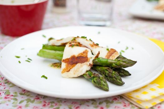 Delicious spring appetizer with grilled asparagus and haloumi cheese
