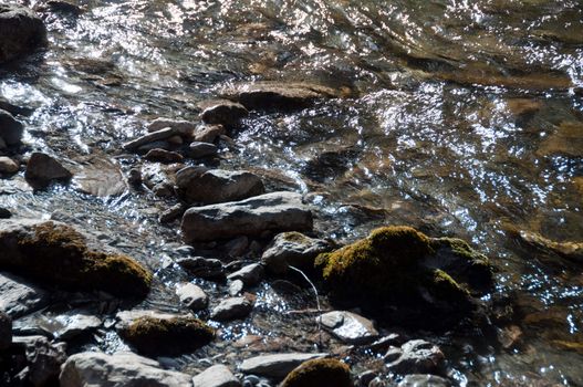 Mountain stream with falls from Hintertux Glacier in Zillertal, Austria
