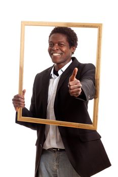 a dark skinned businessman holding a frame showing thumb up