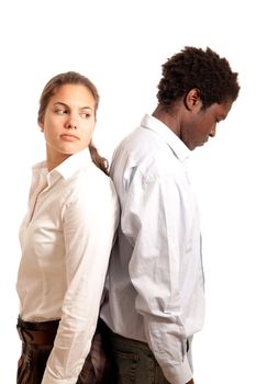 a young couple looking sad standing with their back to each other