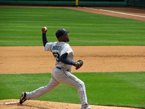 A Seattle Mariners pitcher releasing the ball to a Texas Rangers batter May, 2008 in Ranger stadium in Arlington.
