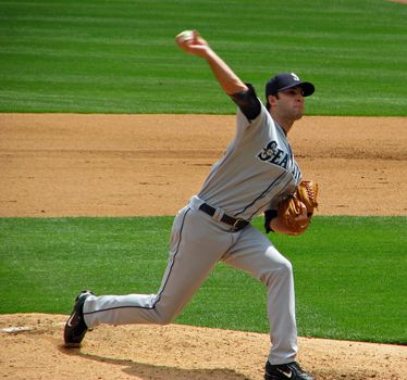 A Seattle Mariners pitcher releasing the ball to a Texas Rangers batter May, 2008 in Ranger stadium in Arlington.
