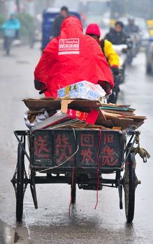 Tricycle in chinese traffic on shanghai street